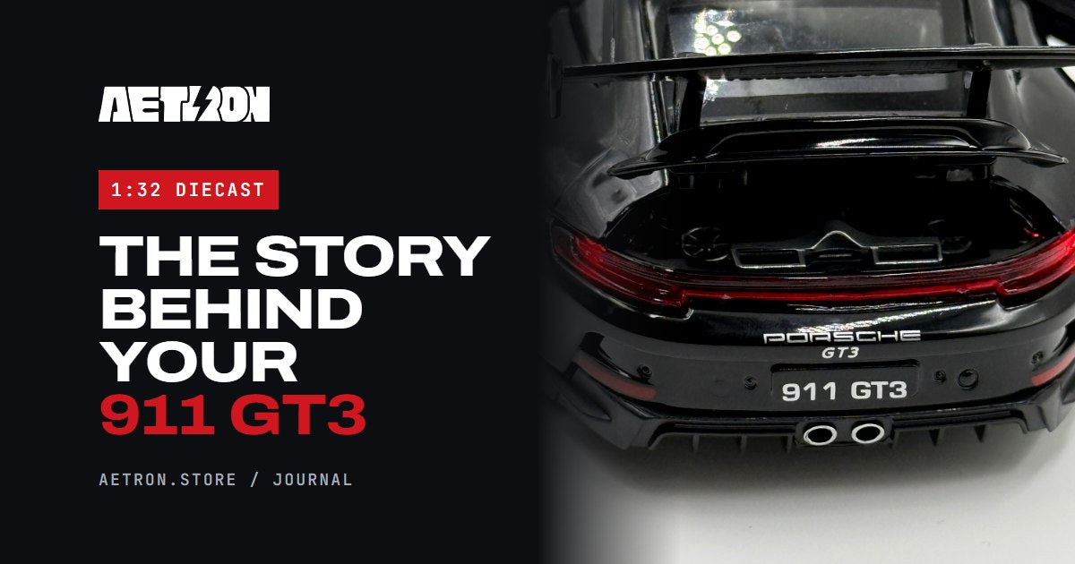Rear of the Aetron 911 GT3 1:32 diecast model in black, showing the swan-neck wing and twin centre exhausts